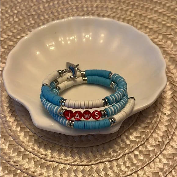 Blue and White Beaded Bracelet with Red Letter Accents Spelling Jaws - Picture 4 of 5